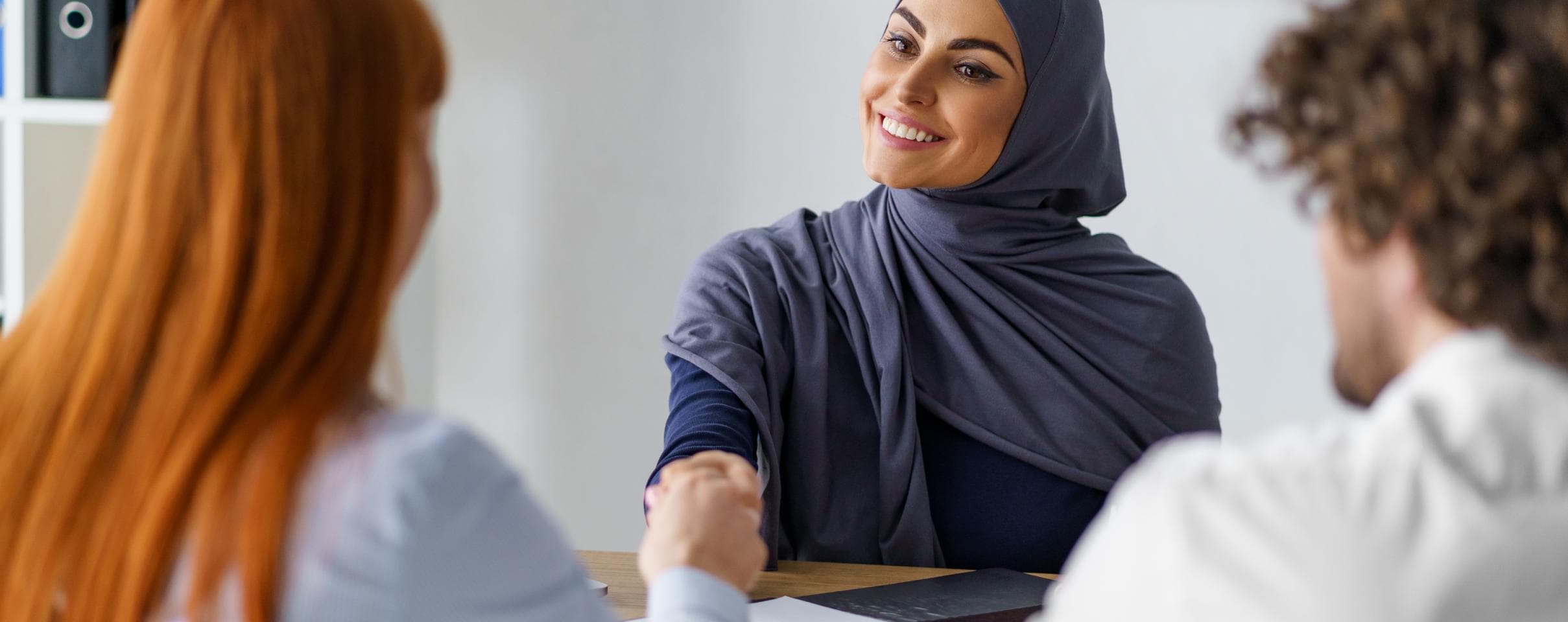 Three employees in a work meeting 